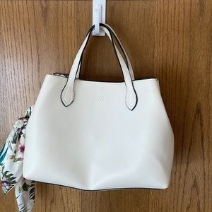 White satchel floral lining with small coin purse also shoulder crossbody strap